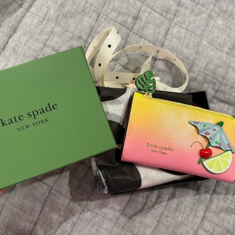 Limited edition Kate Spade Pink and Yellow Wallet with Umbrella Design.